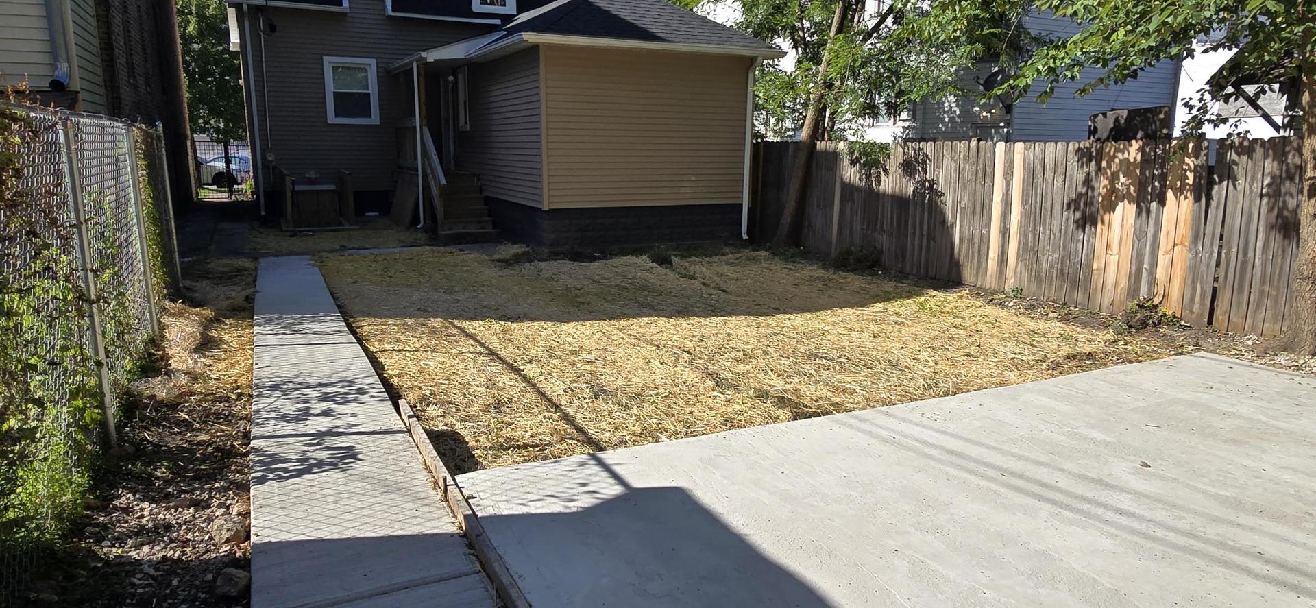11531 South Perry Avenue Chicago, IL 60628 - Photo 15 of 16 a view of a backyard of the house
