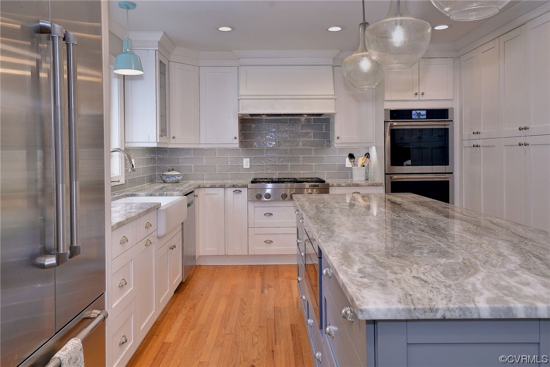 104 Lawnes Circle Williamsburg, VA 23185 - Photo 12 of 49 a large kitchen with stainless steel appliances granite countertop a stove and a refrigerator