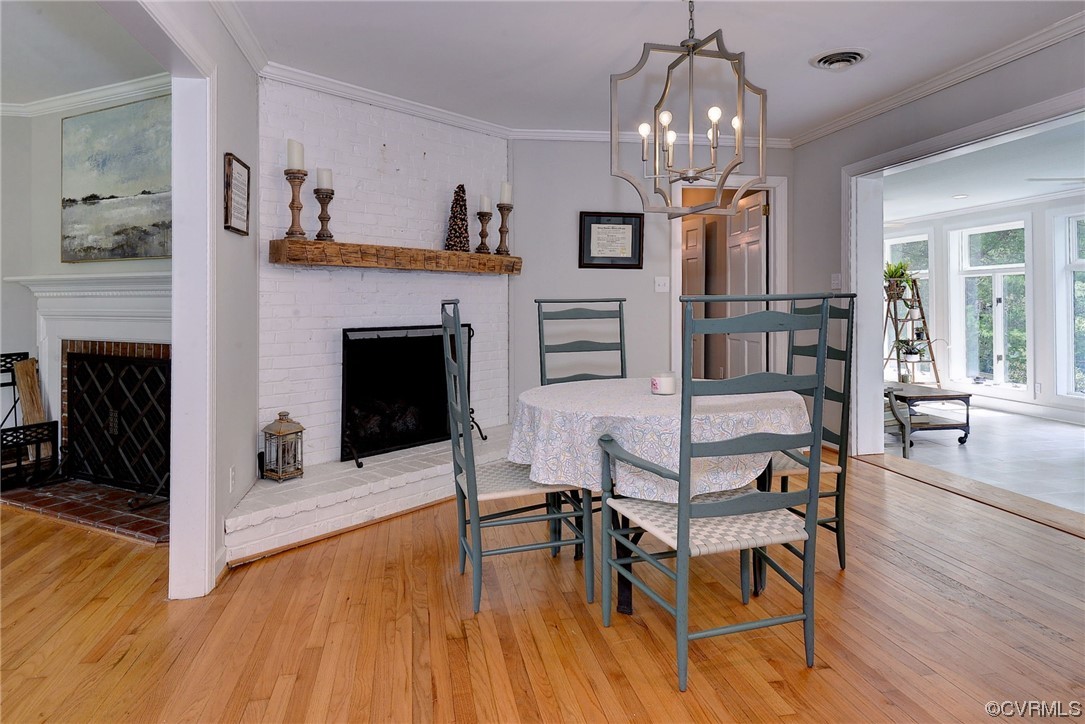 104 Lawnes Circle Williamsburg, VA 23185 - Photo 16 of 49 a view of a livingroom with furniture wooden floor fireplace and a chandelier
