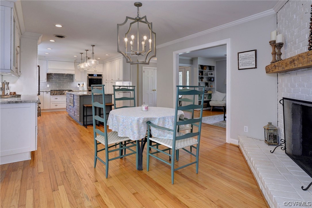 104 Lawnes Circle Williamsburg, VA 23185 - Photo 17 of 49 a view of a dining room with furniture wooden floor and a chandelier