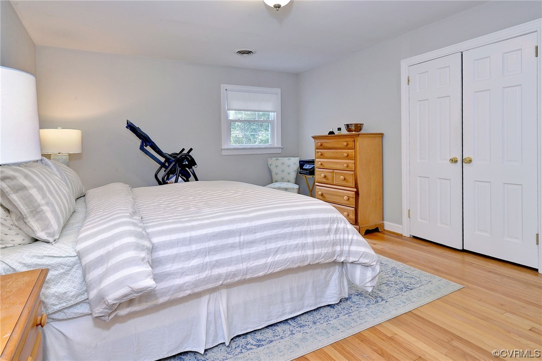 104 Lawnes Circle Williamsburg, VA 23185 - Photo 22 of 49 a bedroom with a bed and wooden floor