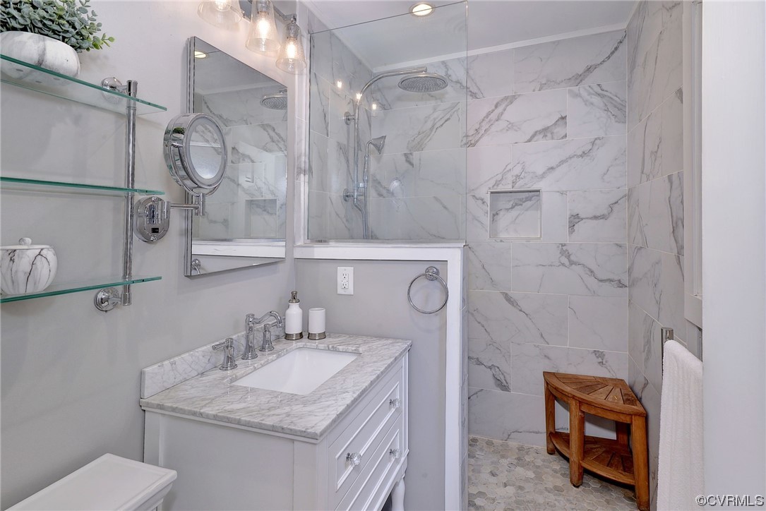 104 Lawnes Circle Williamsburg, VA 23185 - Photo 23 of 49 a bathroom with a granite countertop sink a toilet and shower