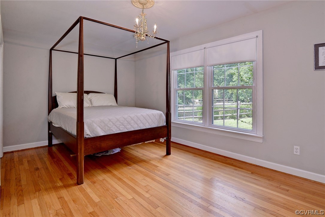 104 Lawnes Circle Williamsburg, VA 23185 - Photo 25 of 49 a bedroom with a bed and wooden floor