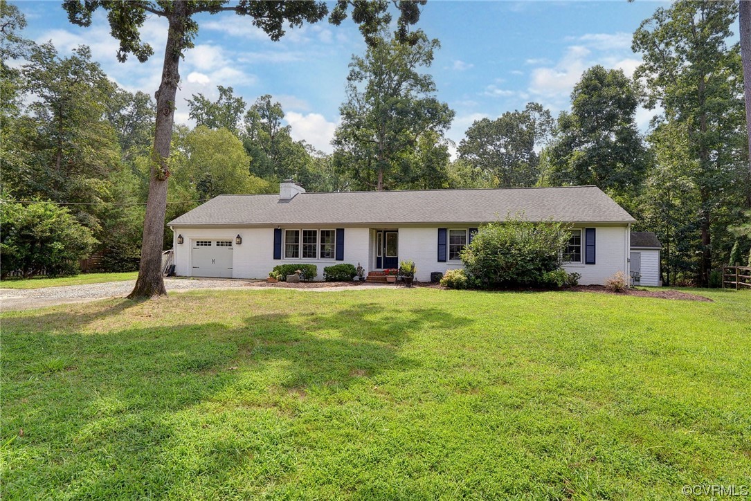 104 Lawnes Circle Williamsburg, VA 23185 - Photo 3 of 49 a front view of a house with a yard and trees