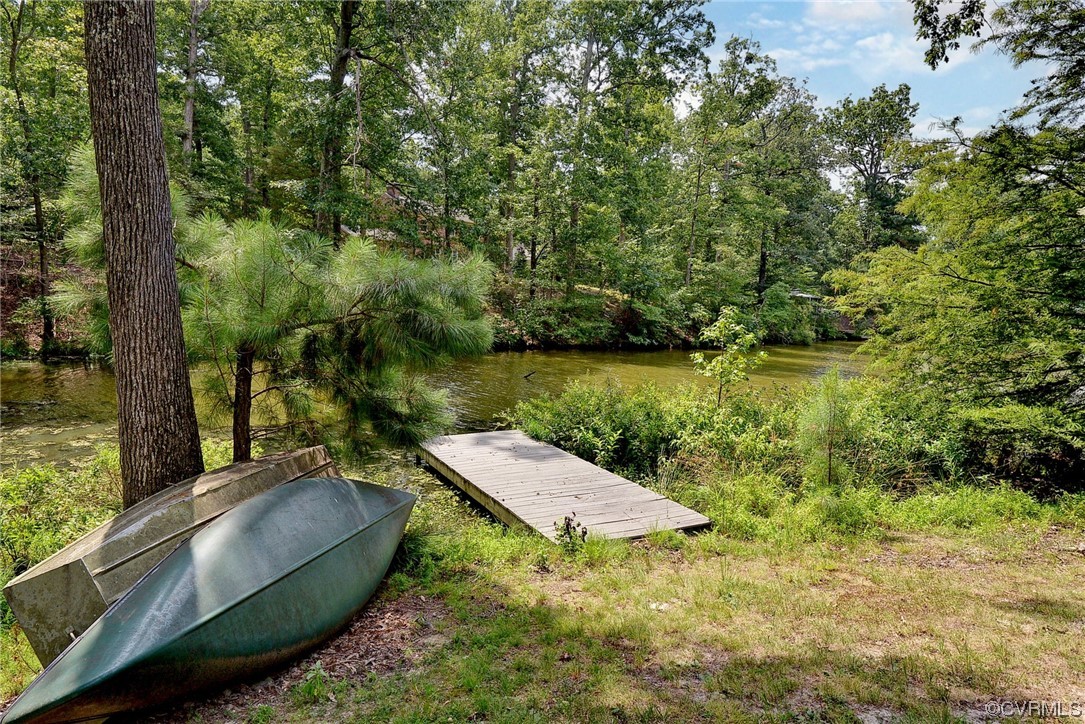 104 Lawnes Circle Williamsburg, VA 23185 - Photo 35 of 49 a view of a lake with a yard