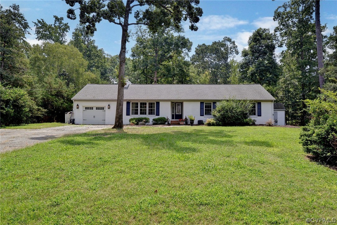 104 Lawnes Circle Williamsburg, VA 23185 - Photo 4 of 49 a front view of a house with a yard table and trees