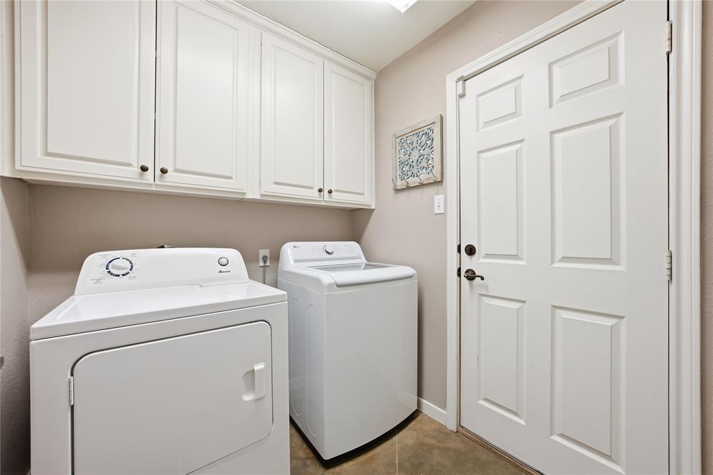 10504 Whitney Trace Drive Waco, TX 76708 - Photo 9 of 24 a utility room with dryer and washer