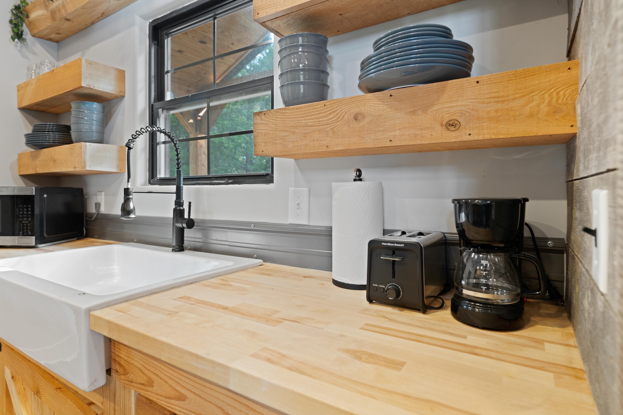 3320 Slayden-Marion Road Cumberland Furnace, TN 37051 - Photo 20 of 43 a bedroom with a bed and a chandelier