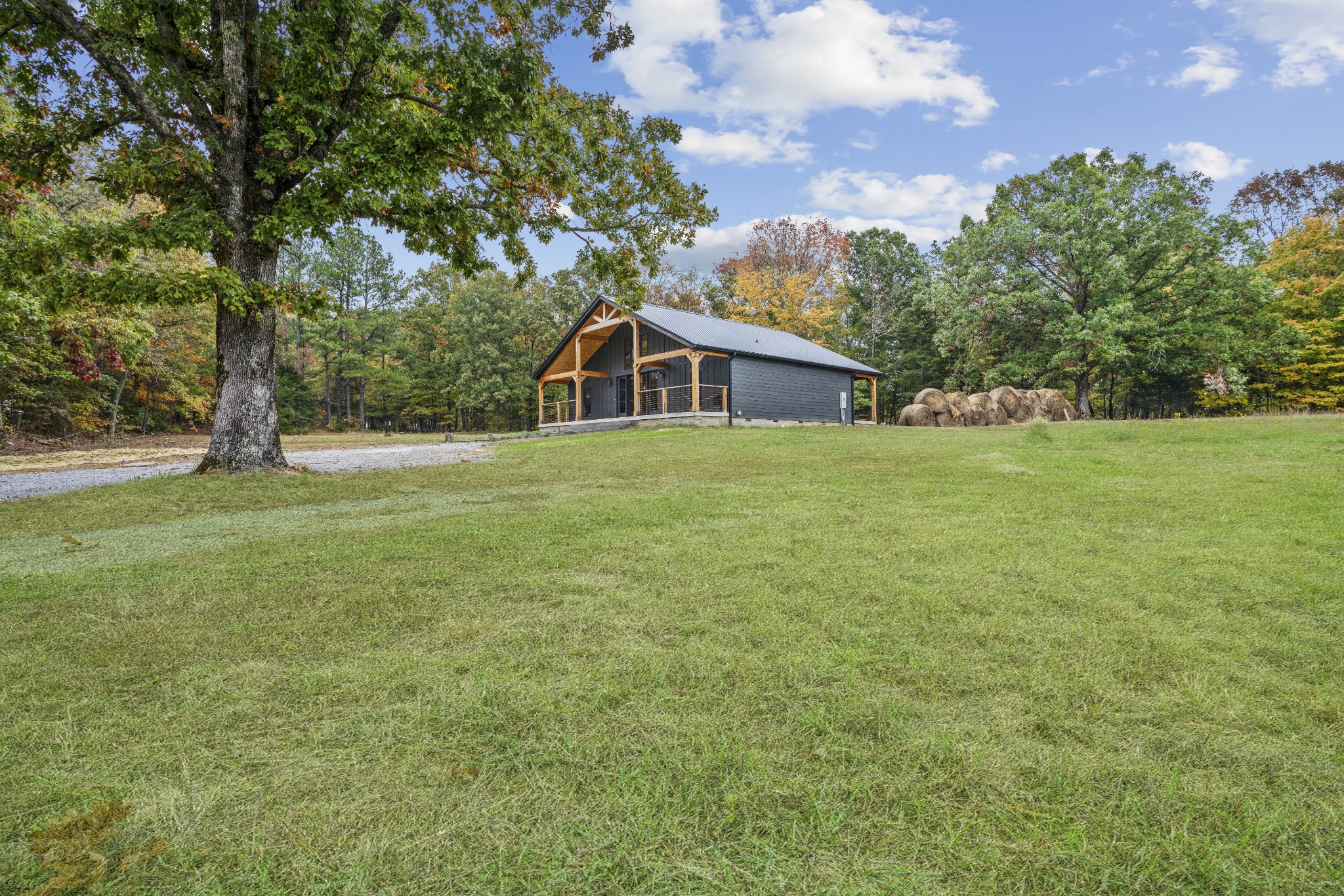 3320 Slayden-Marion Road Cumberland Furnace, TN 37051 - Photo 27 of 43 a big house with a big yard and large trees