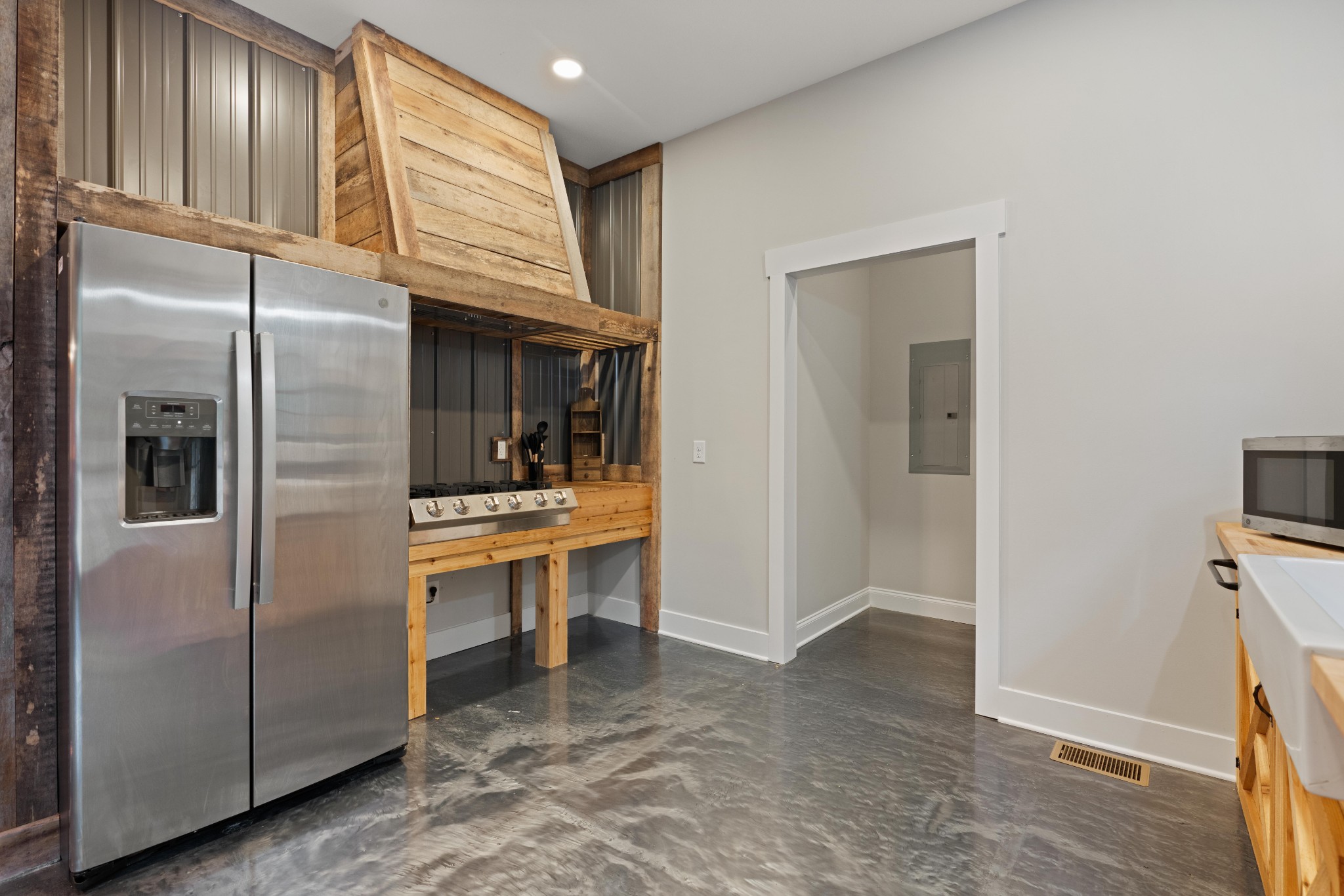 3320 Slayden-Marion Road Cumberland Furnace, TN 37051 - Photo 35 of 43 a view of cabinets a sink and a refrigerator in a kitchen