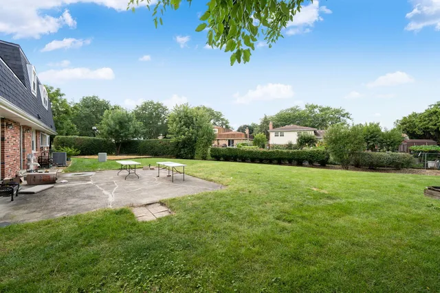 a view of a patio with a yard