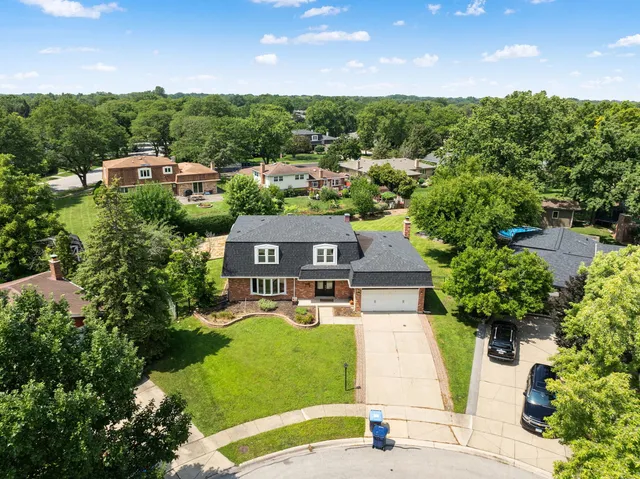 aerial view of a house with a garden