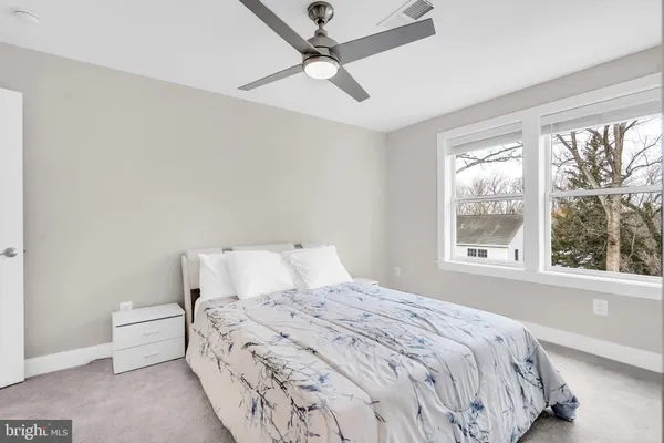 a bedroom with a bed and window