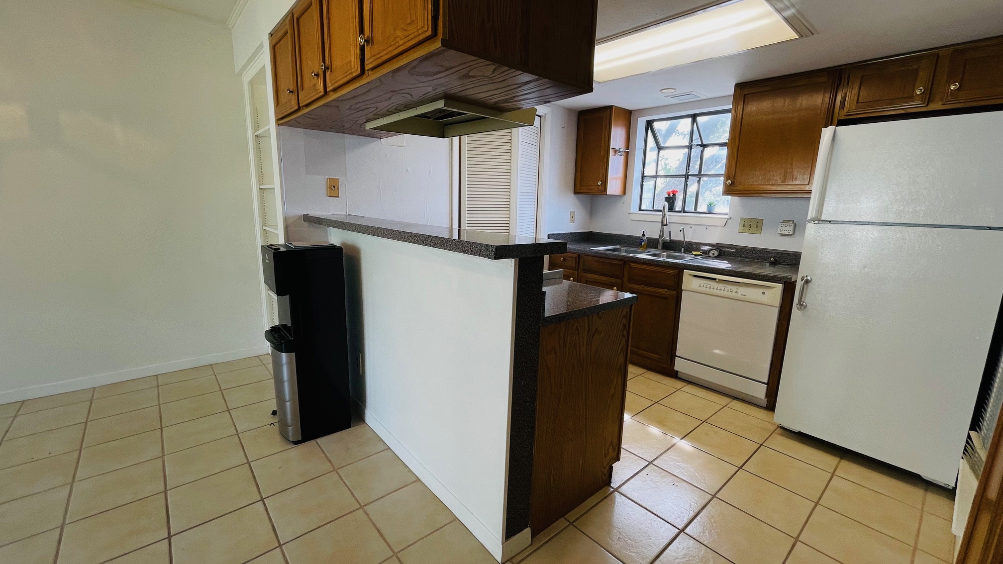 1510 West N Loop Boulevard, Unit 822 Austin, TX 78756 - Photo 2 of 12 a kitchen with stainless steel appliances granite countertop a refrigerator and a stove