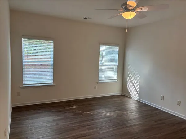 a kitchen with stainless steel appliances granite countertop wooden cabinets a refrigerator and a stove