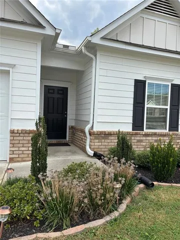 a bathroom with a toilet and a bathtub