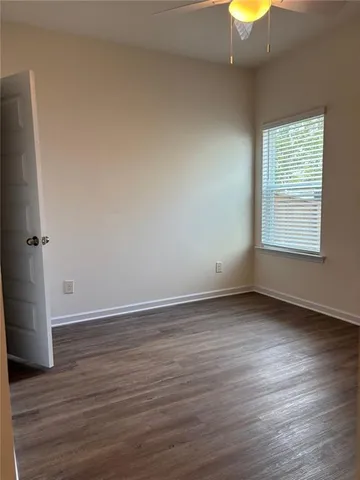 a white bath tub sitting next to a shower