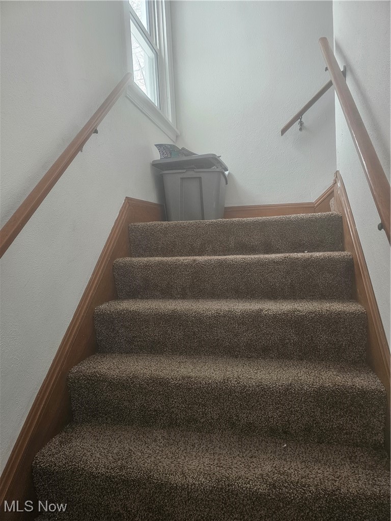 25150 Columbus Road Bedford Heights, OH 44146 - Photo 16 of 30 Stairs featuring a textured wall