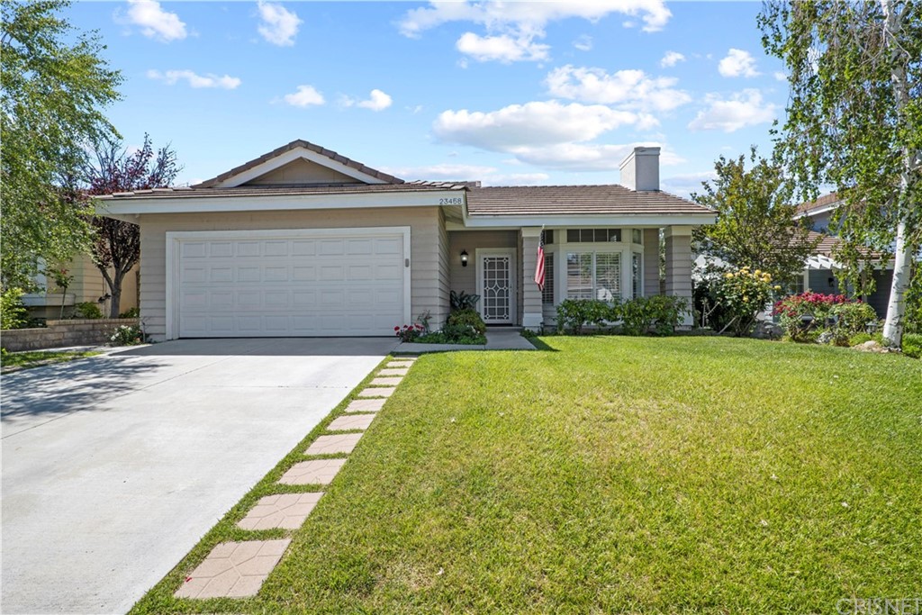 23458 Riversbridge Way Valencia, CA 91354 - Photo 1 of 1 a front view of a house with garden