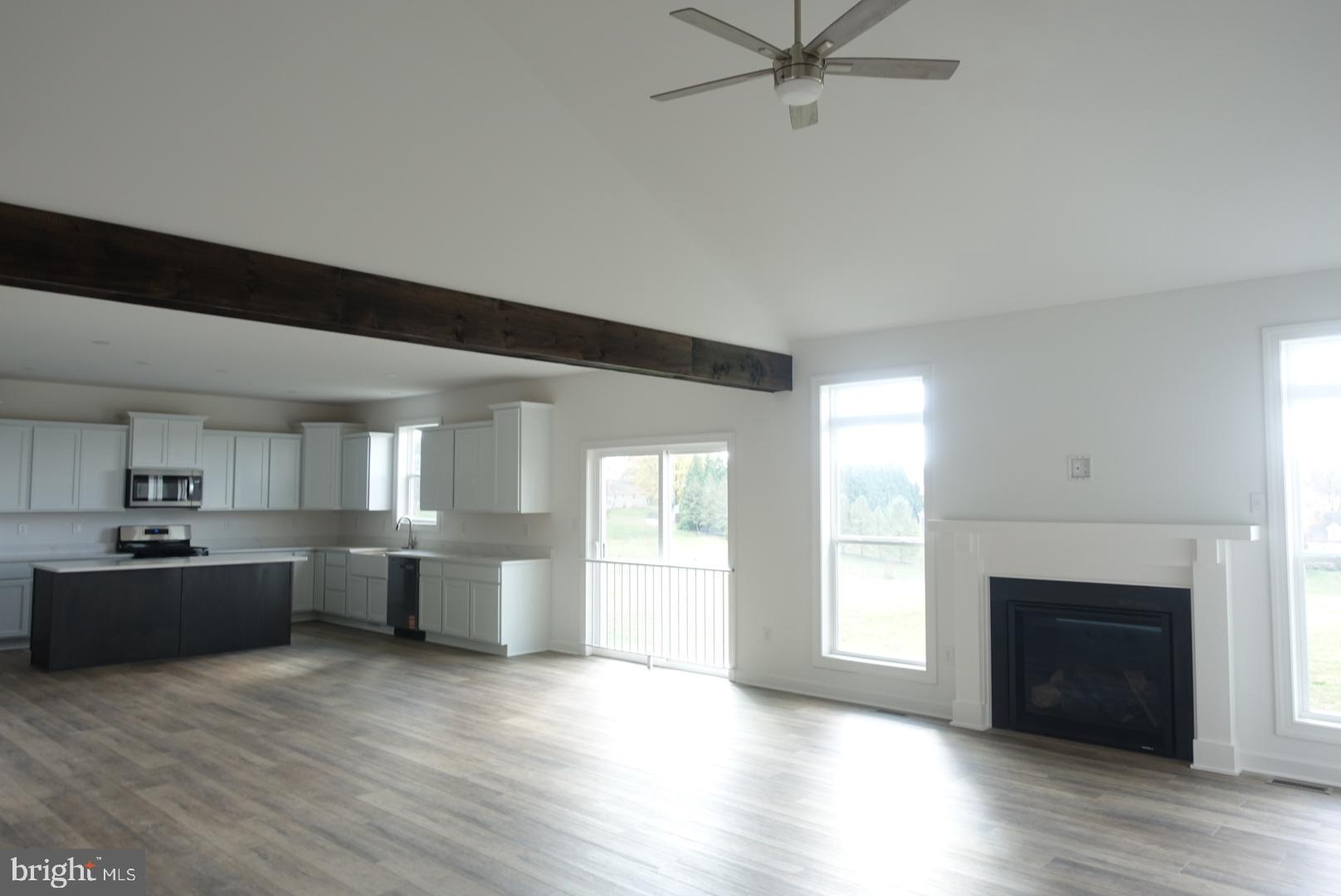 347 Steeple View Drive, Unit 11 Hanover, PA 17331 - Photo 12 of 47 a large kitchen with a lot of cabinets and wooden floor