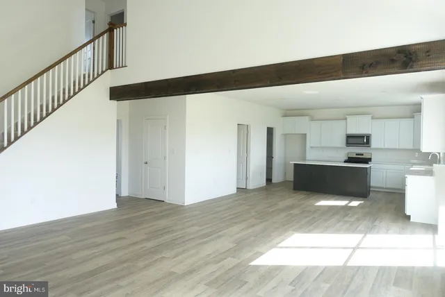 a view of a kitchen with wooden floor