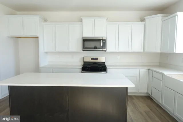 a kitchen with a sink and a stove