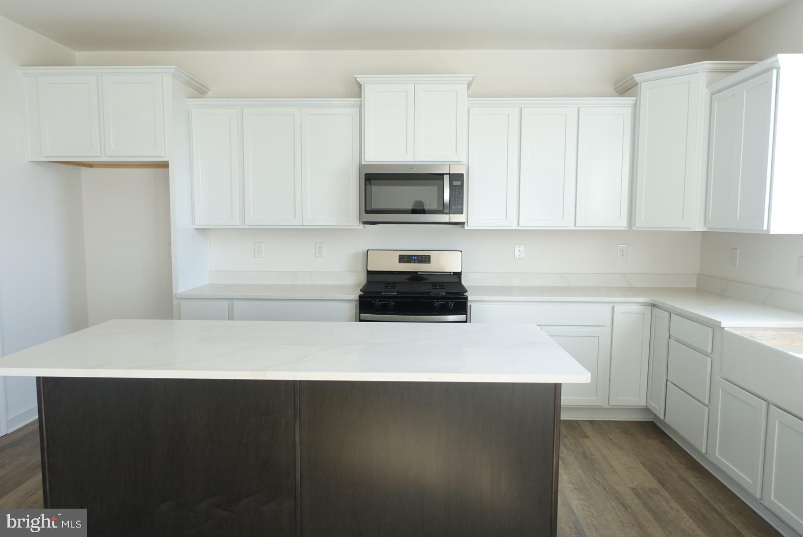 347 Steeple View Drive, Unit 11 Hanover, PA 17331 - Photo 29 of 47 a kitchen with a sink and a stove