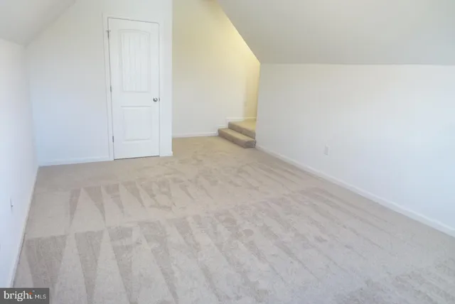 an empty room with closet area