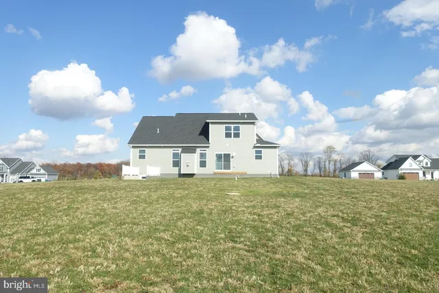 a backyard of a white house
