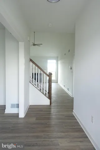 a view of entryway with wooden floor