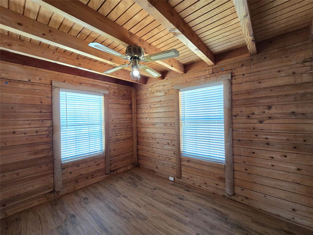 3505 Farmer Road Azle, TX 76020 - Photo 16 of 40 Rustic shiplap exterior walls in downstairs rear bedroom!