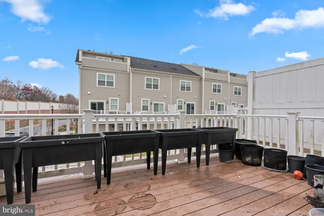 a balcony with table and chairs