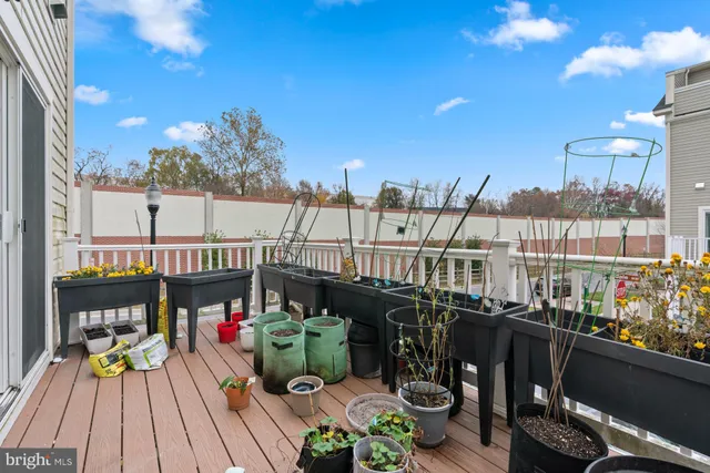 a view of a balcony with outdoor seating