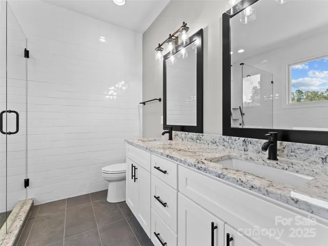 a white bath tub sitting next to a shower