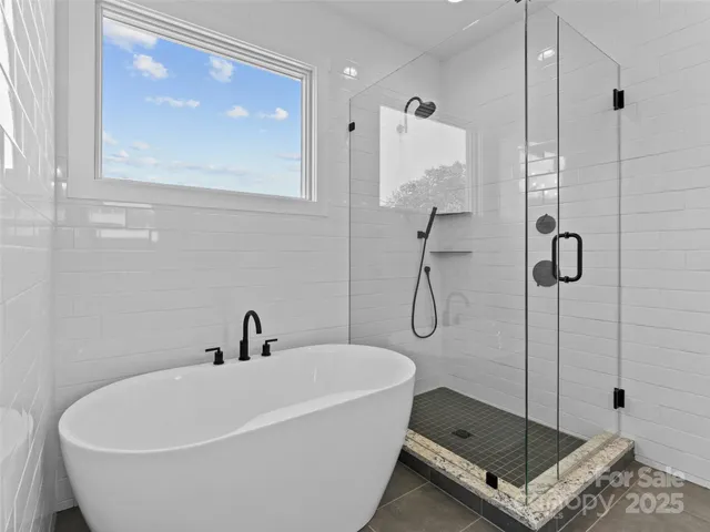 a bathroom with a granite countertop sink toilet and mirror