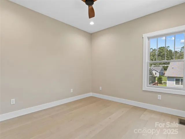 an empty room with cabinet and closet