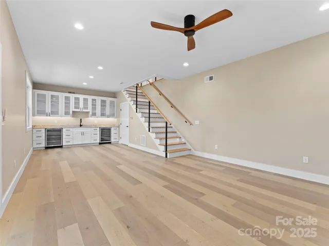 a kitchen with granite countertop a sink and cabinets