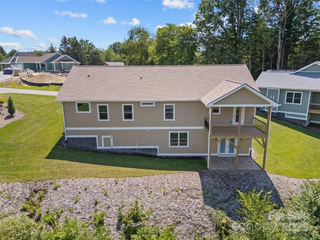 a aerial view of a house with a yard