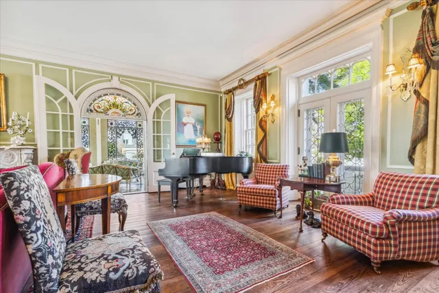 a living room with furniture or couch and a large window