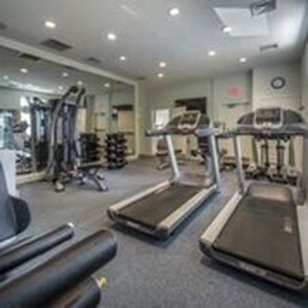 1 Katahdin Drive, Unit 202 Lexington, MA 02421 - Photo 5 of 6 a room with gym equipment and a large window