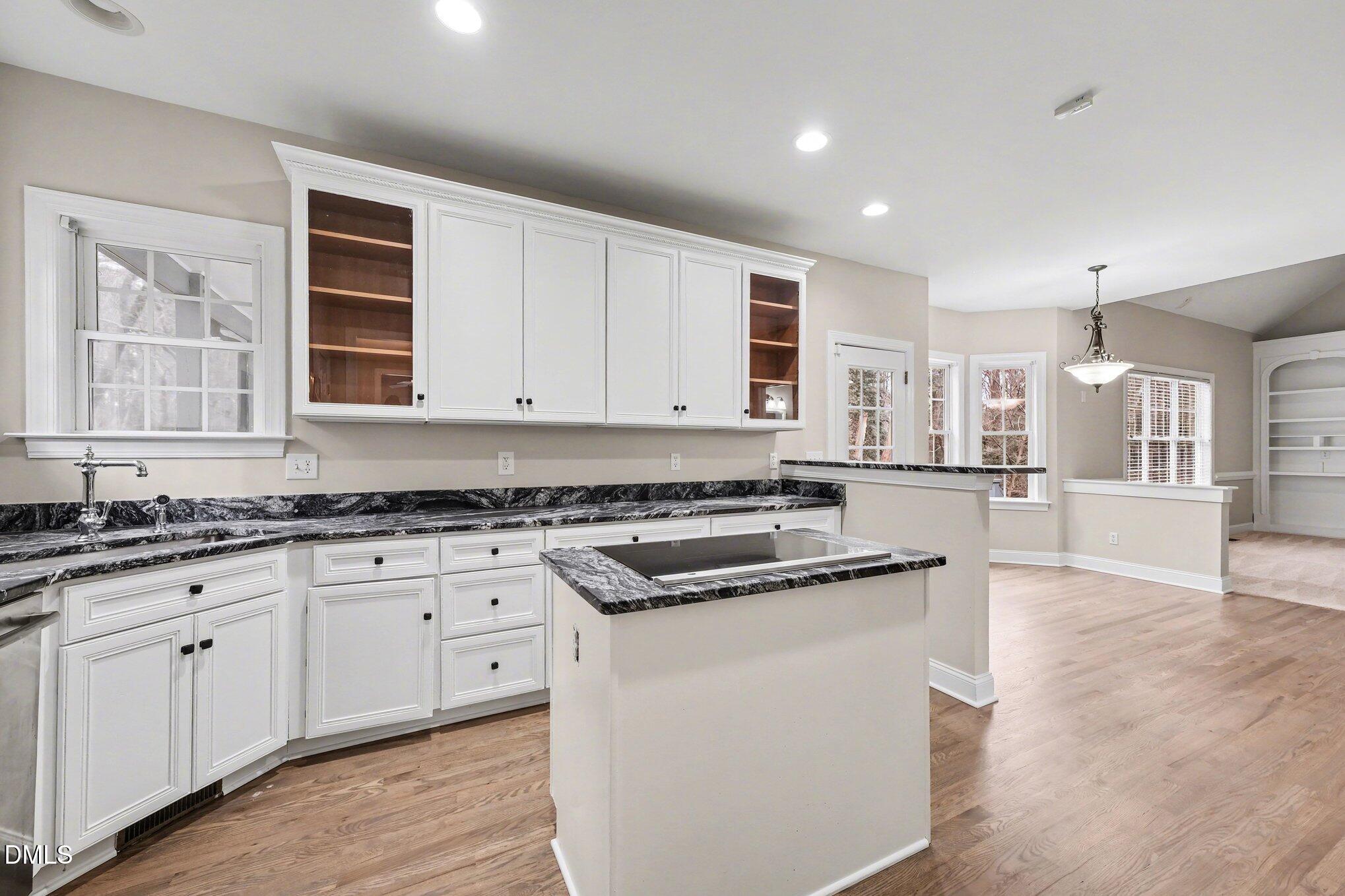4613 Cherrybark Lane Raleigh, NC 27616 - Photo 6 of 27 a kitchen with stainless steel appliances granite countertop a stove and a sink