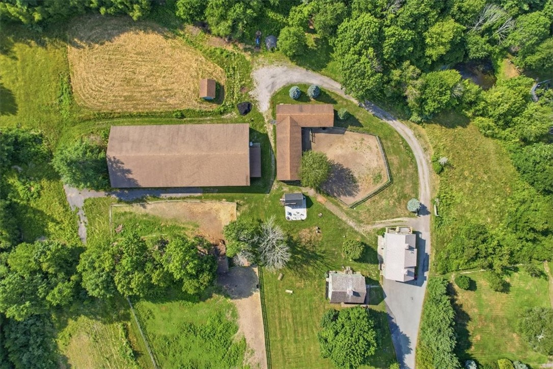 32 Equestrian Way Cranston, RI 02921 - Photo 2 of 50 A secluded equestrian retreat surrounded by woodlands, with the farmhouse, garage, arenas, barn, paddocks and outbuildings arranged across nearly eight acres.