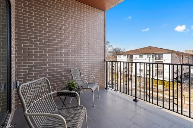a view of a balcony with furniture