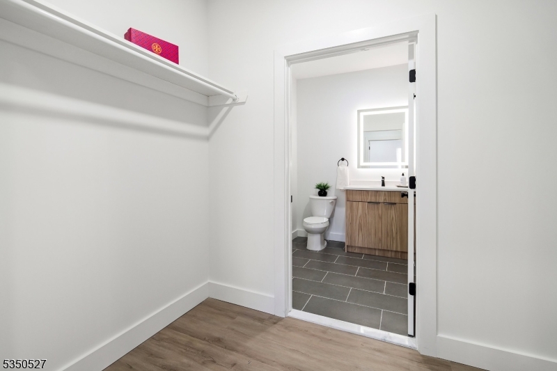310 West Jersey Street, Unit 404 Elizabeth, NJ 07202 - Photo 3 of 14 a bathroom with a sink and a toilet