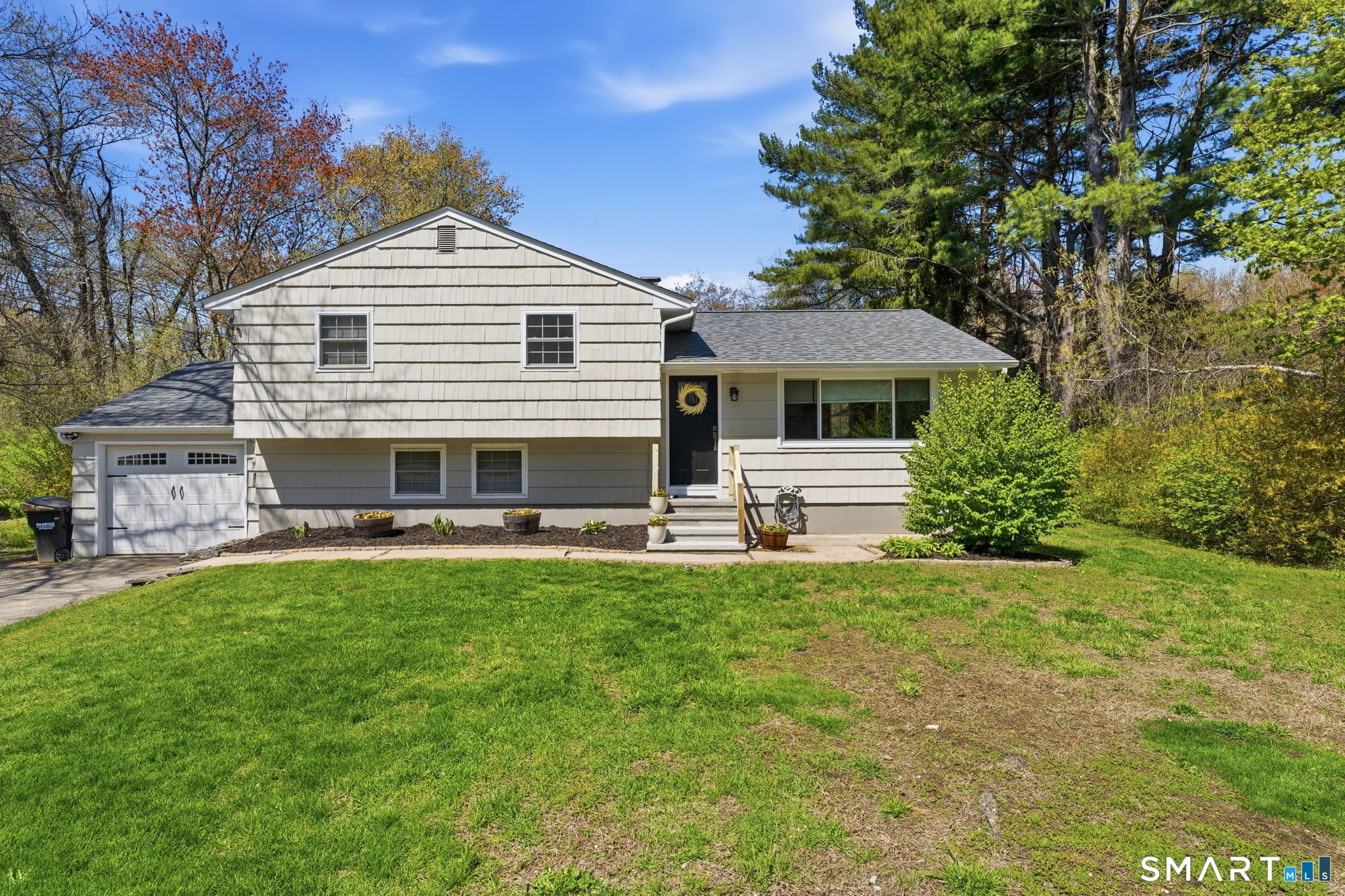 523 Essex Road Westbrook, CT 06498 - Photo 1 of 37 a front view of a house with a garden
