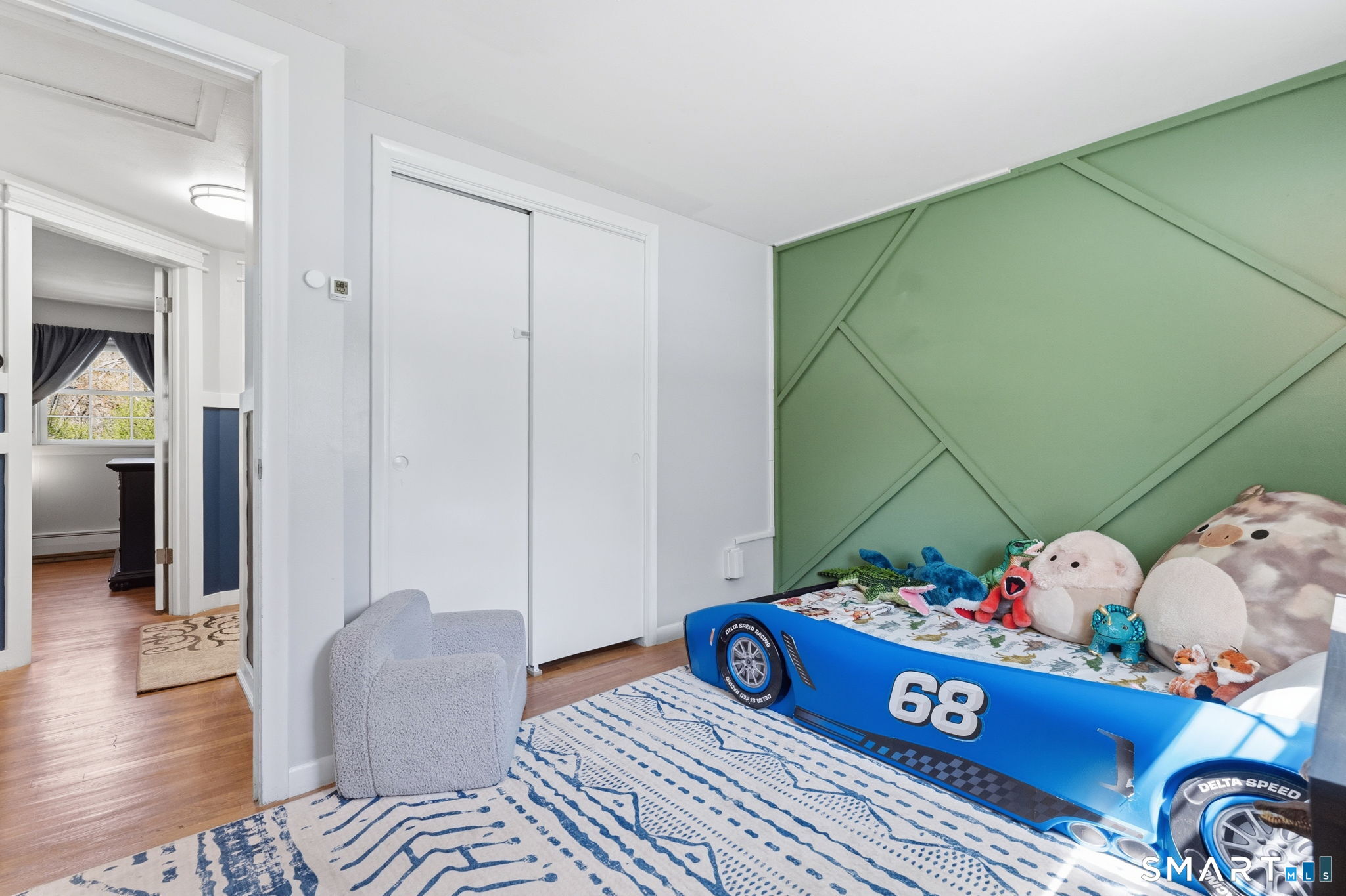 523 Essex Road Westbrook, CT 06498 - Photo 18 of 37 a bed room with a bed and a table