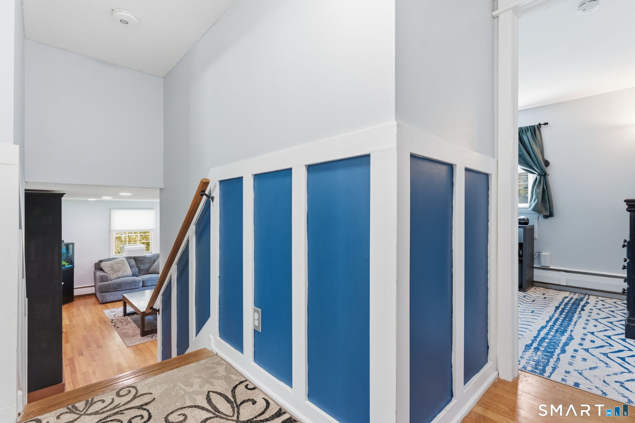 523 Essex Road Westbrook, CT 06498 - Photo 19 of 37 a view of a hallway with furniture and staircase