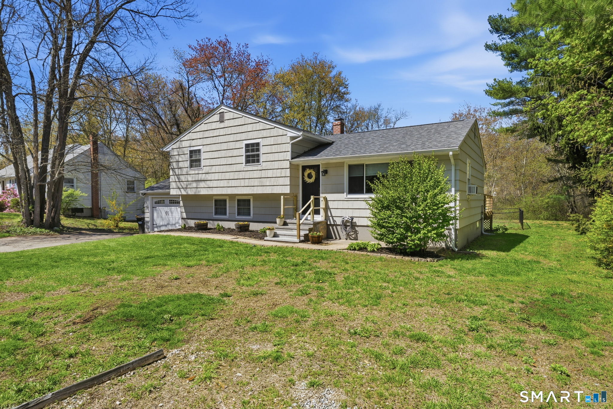 523 Essex Road Westbrook, CT 06498 - Photo 2 of 37 a front view of a house with a yard