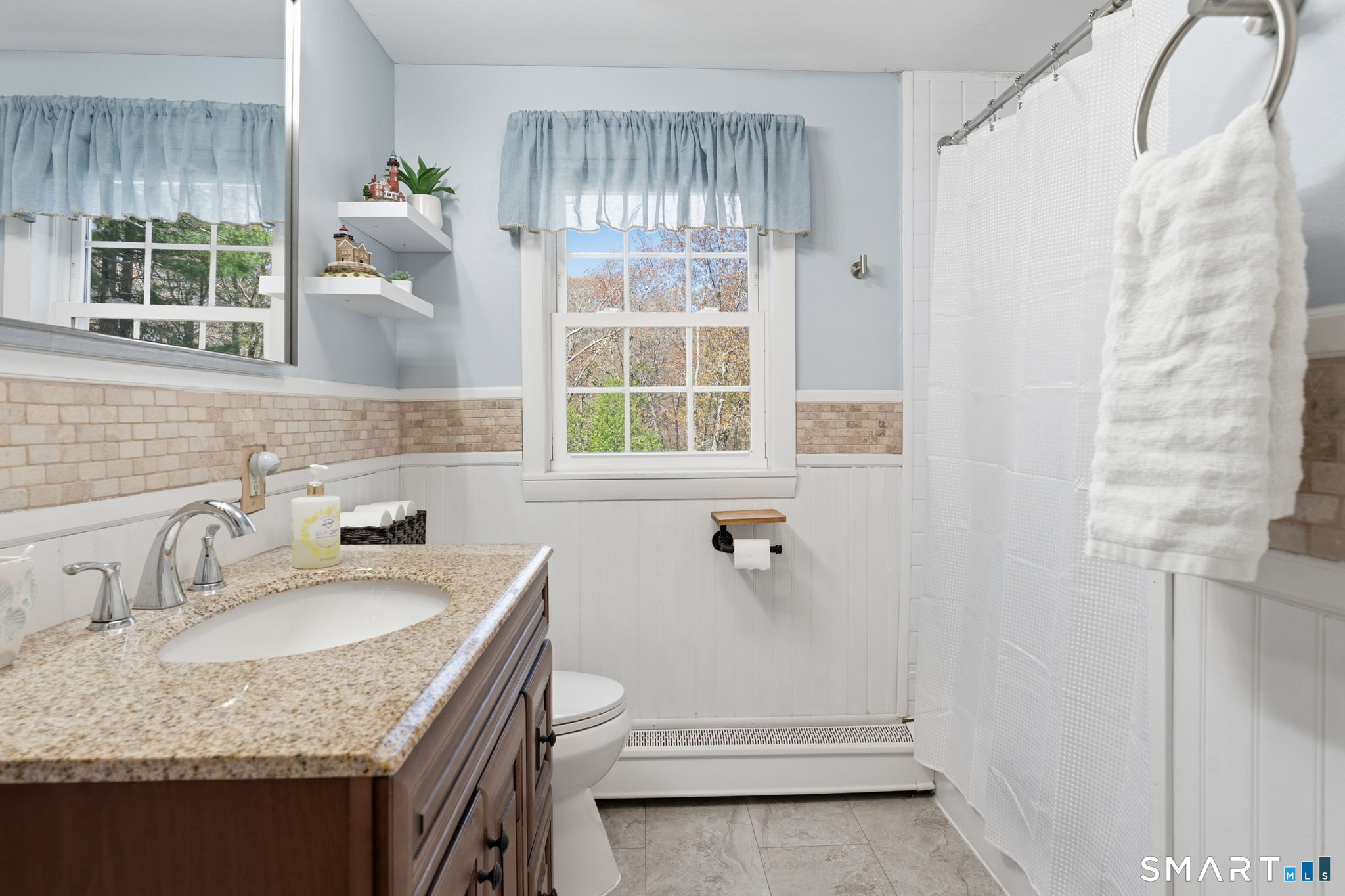 523 Essex Road Westbrook, CT 06498 - Photo 21 of 37 a bathroom with a granite countertop sink and a window