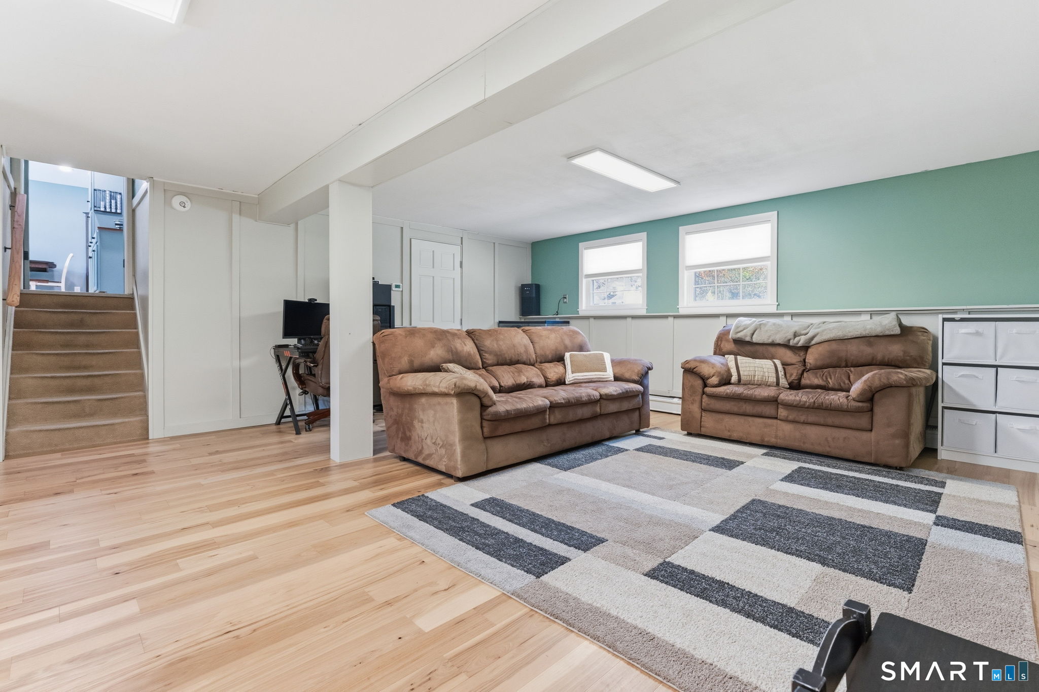 523 Essex Road Westbrook, CT 06498 - Photo 23 of 37 a living room with furniture and a couch